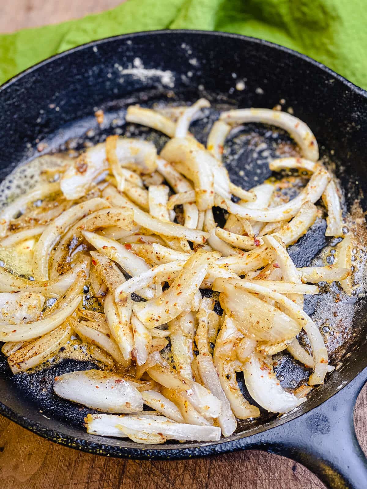 onions cooking down in cast iron pan