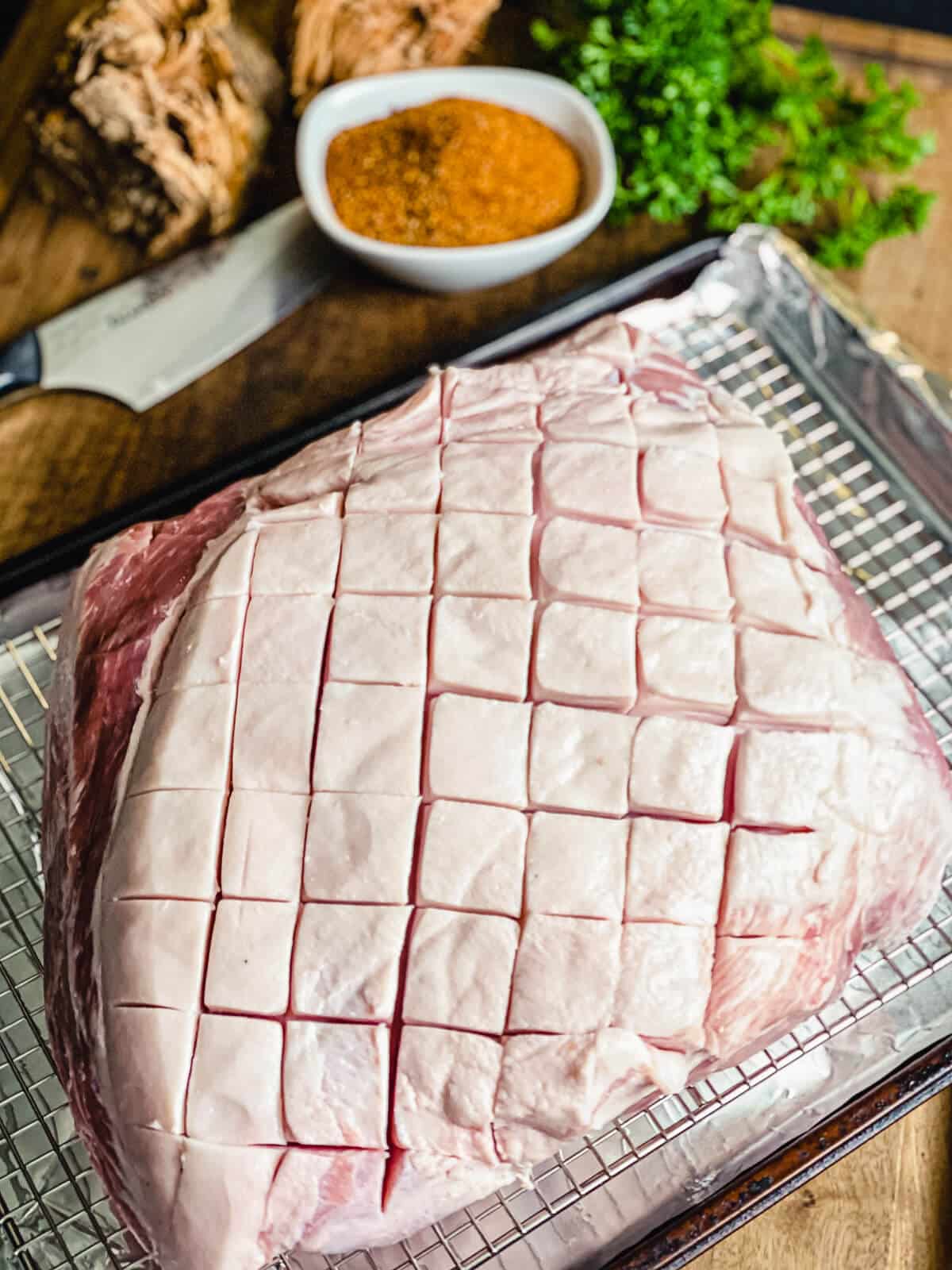 pork shoulder with cross hatch marks in fat cap