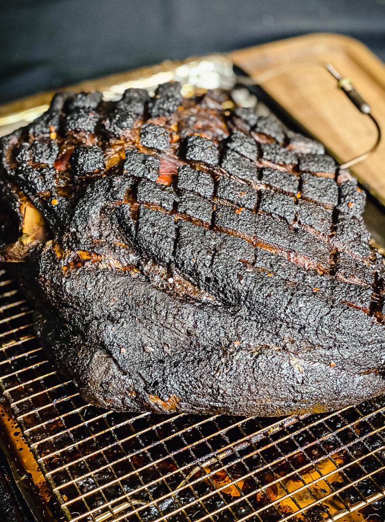 smoked pork shoulder on a cooling rack