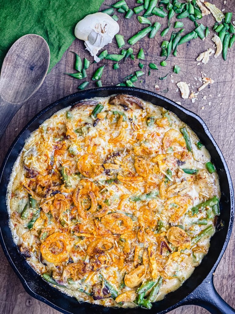 smoked green bean casserole in a pan on a cutting board