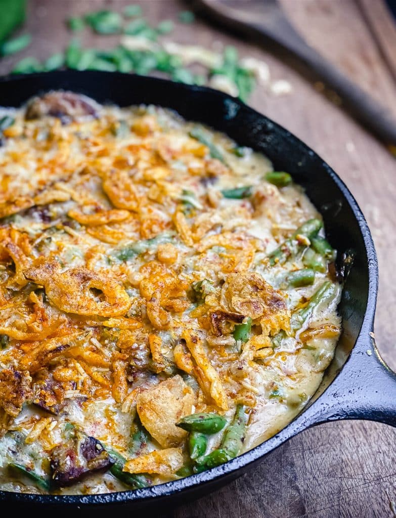 smoked green bean casserole in a cast iron pan