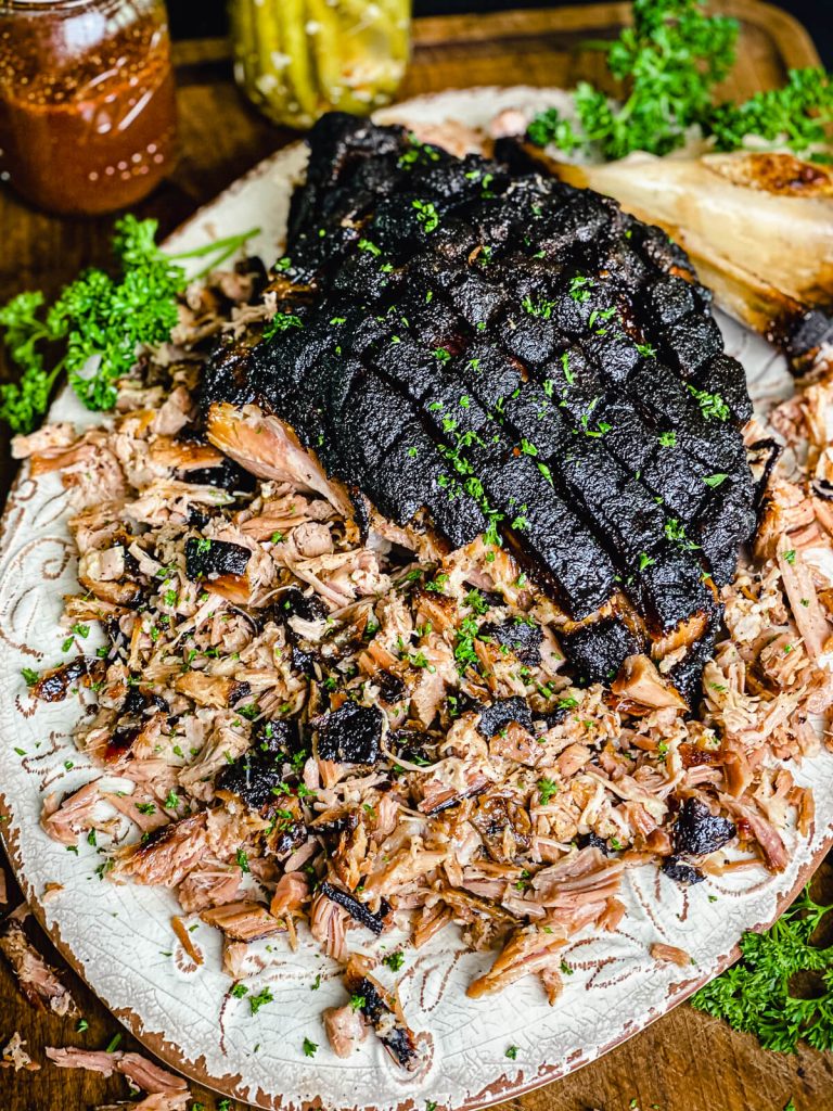 smoked pork butt pulled apart on a platter