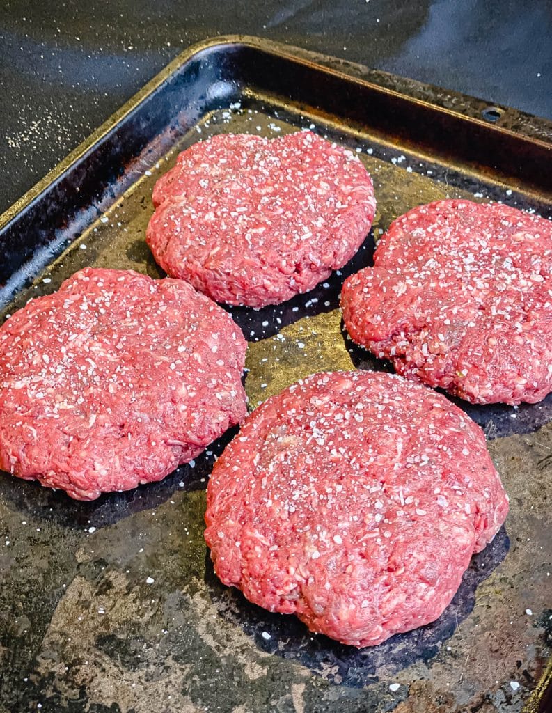 venison burger patties on a serving platter