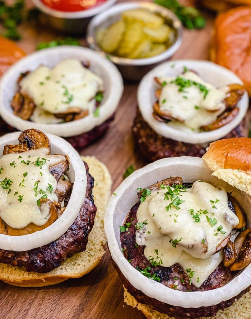 venison burgers on a cutting board