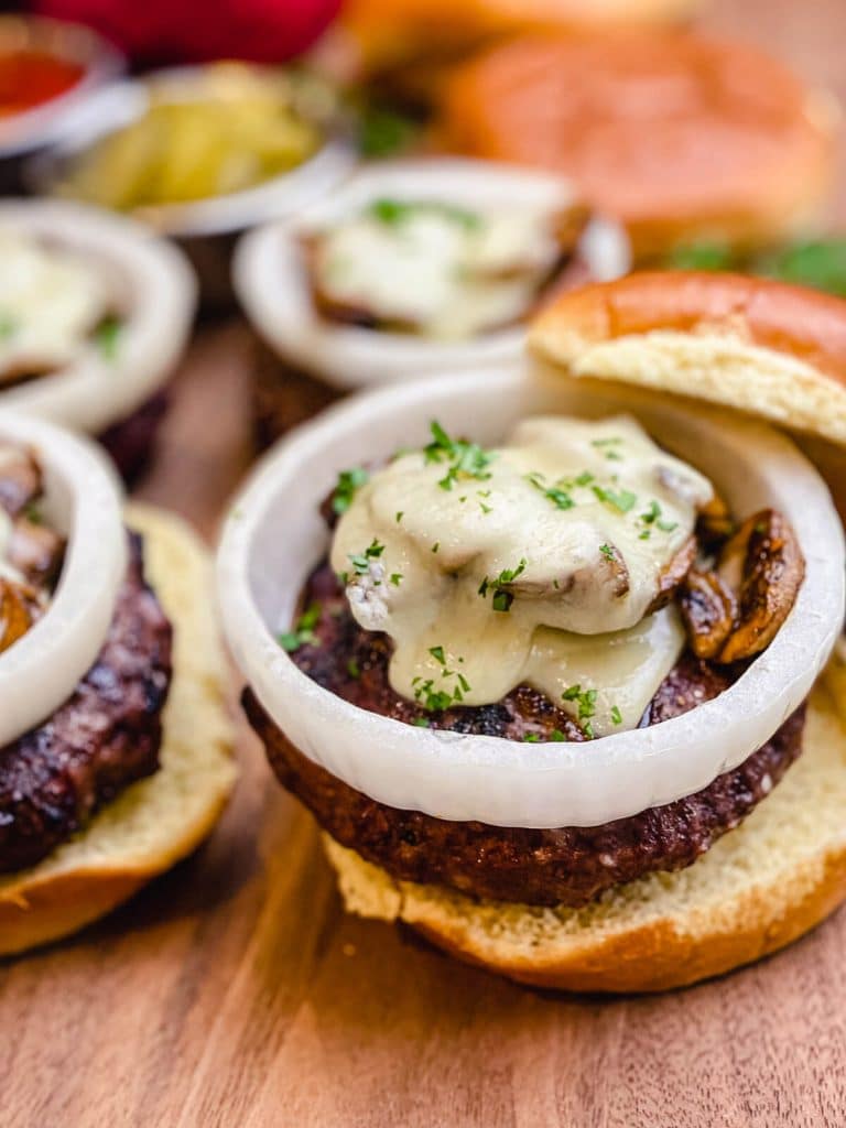 venison burger with melted cheese on top