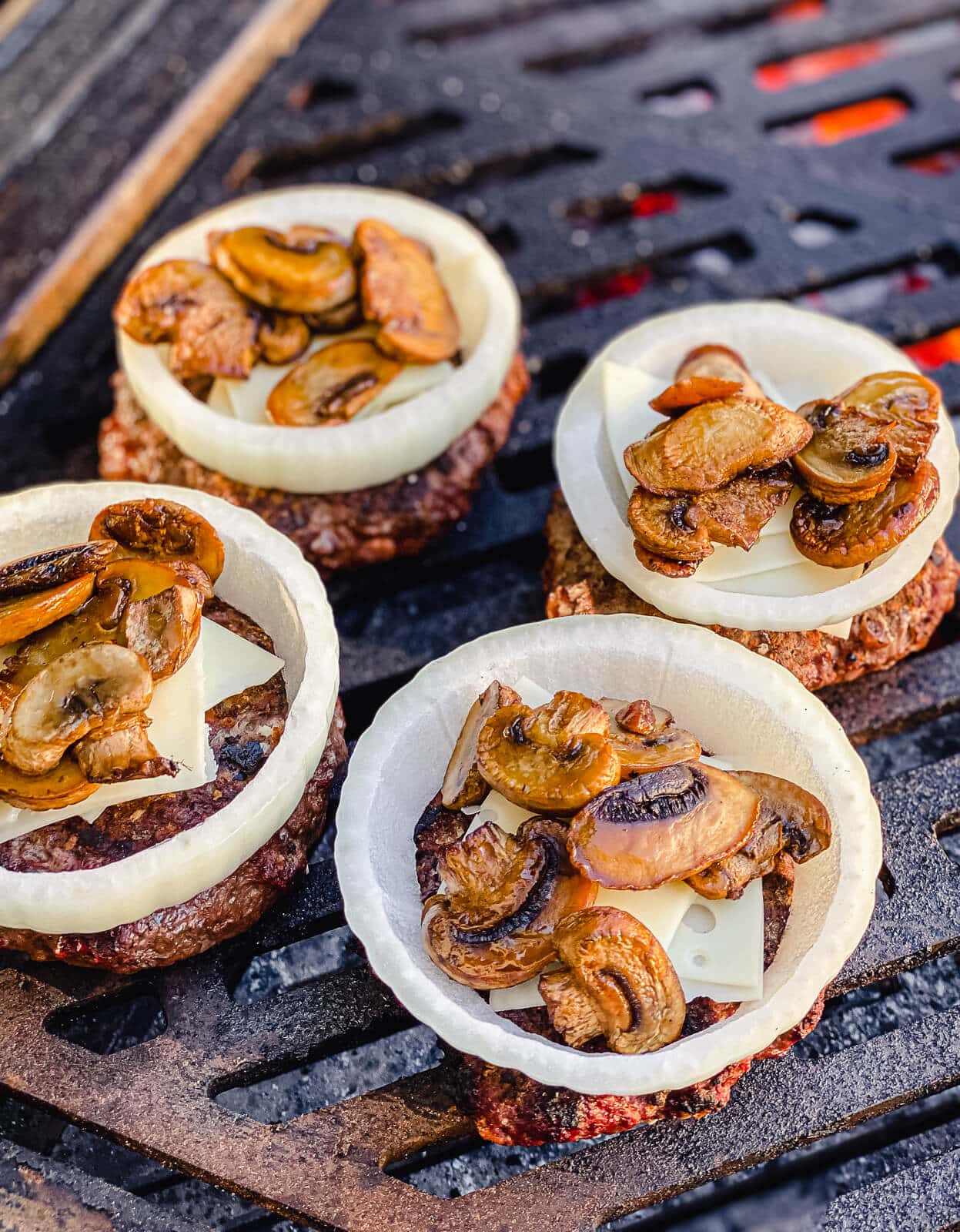 venison burgers topped with mushrooms