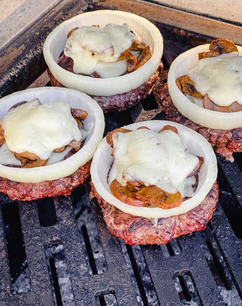 venison burgers with melted Swiss cheese and mushrooms