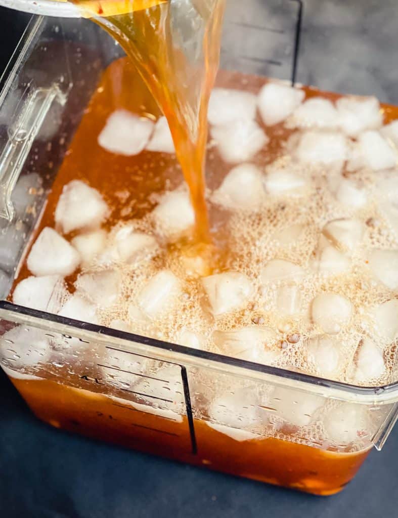 chicken brine being poured over ice