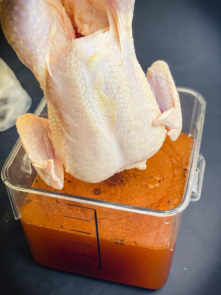 chicken being put into brine