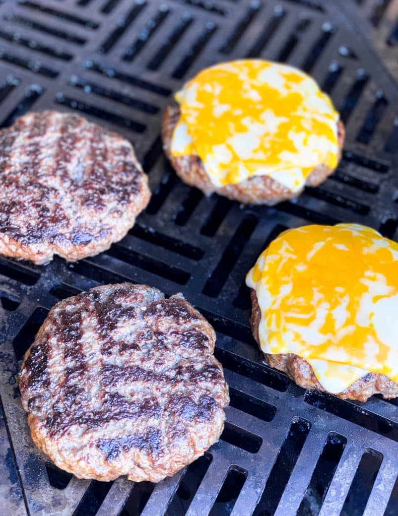 burgers over indirect heat with melted cheese