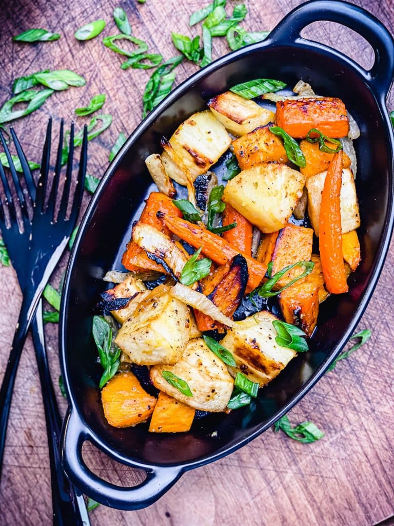 roasted root vegetables in a black pan