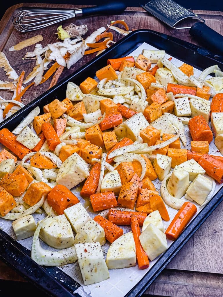 root vegetables spread out on a baking sheet