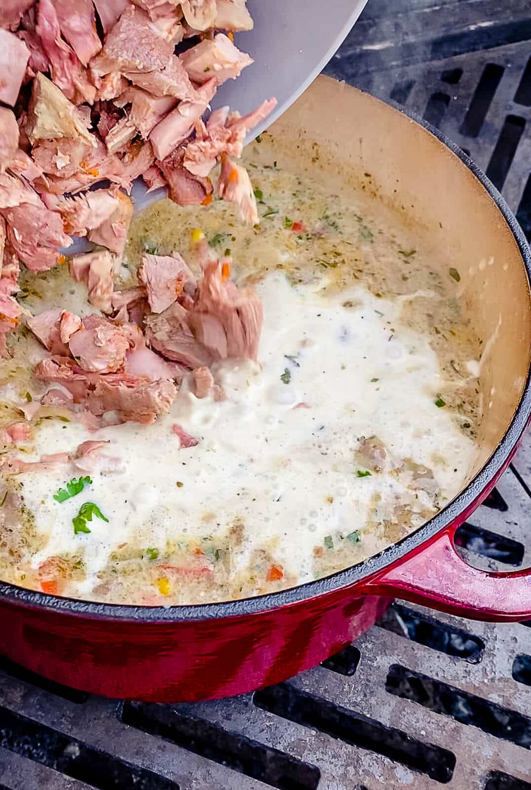 meat being added to chicken chili