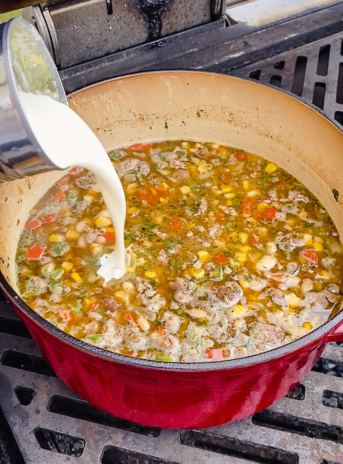 cream being added to chicken chili