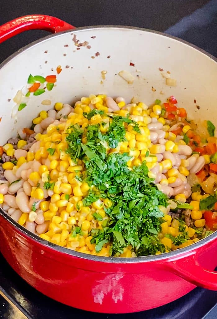 chili ingredients in a dutch oven