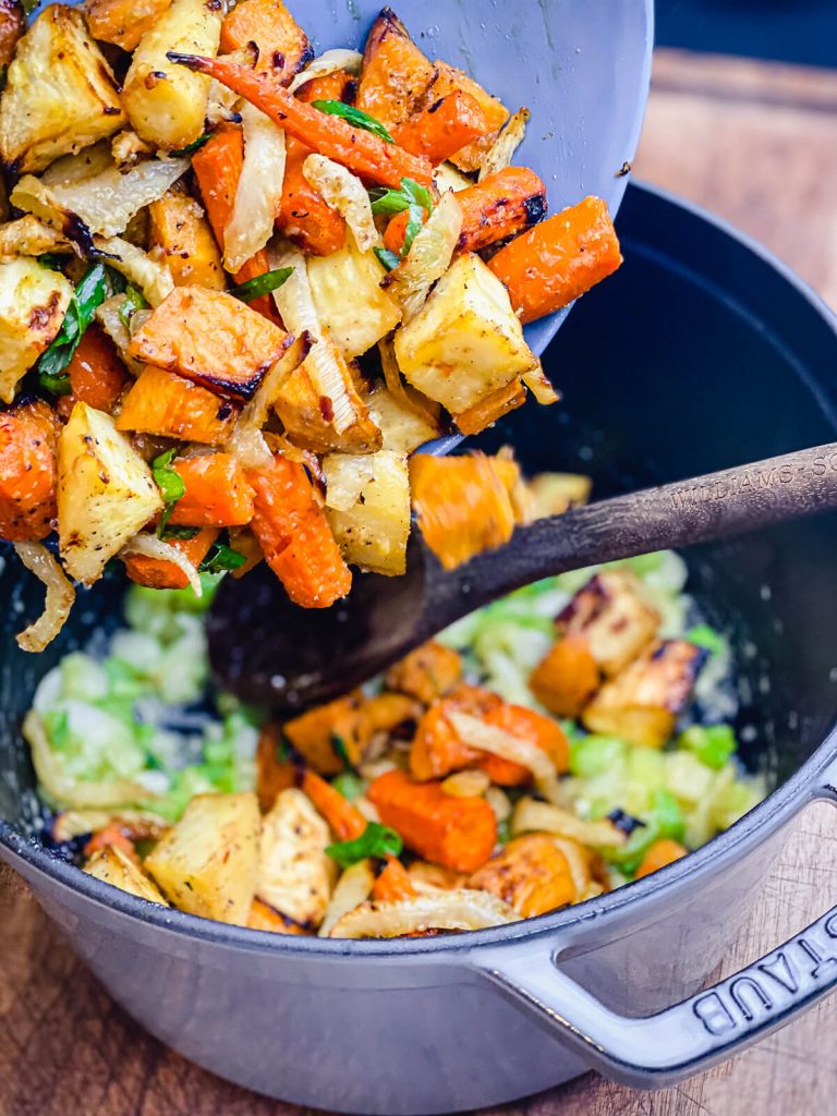 vegetables going into a stock pot