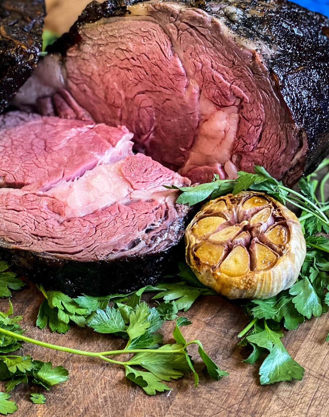 prime rib, grilled and sliced on a cutting board