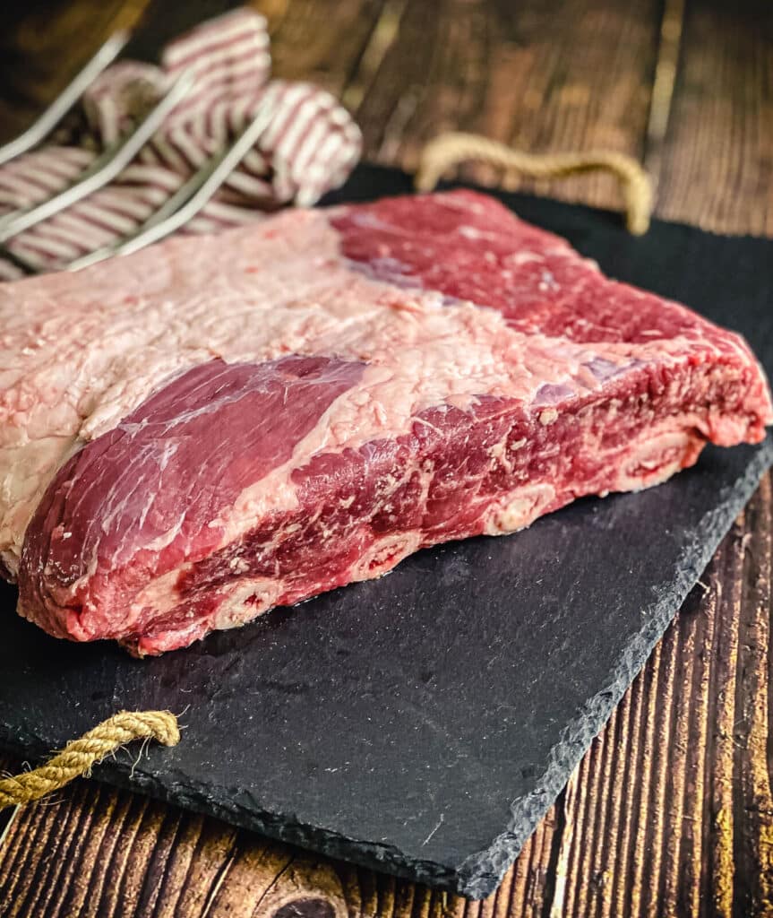 uncooked beef short ribs on a cutting board