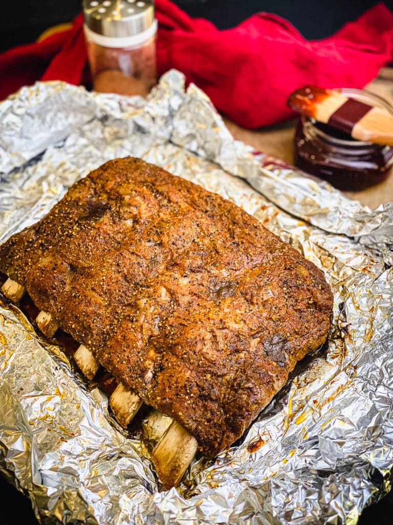 beef ribs unwrapped on top of foil