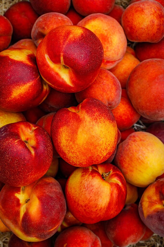pile of fresh summer peaches