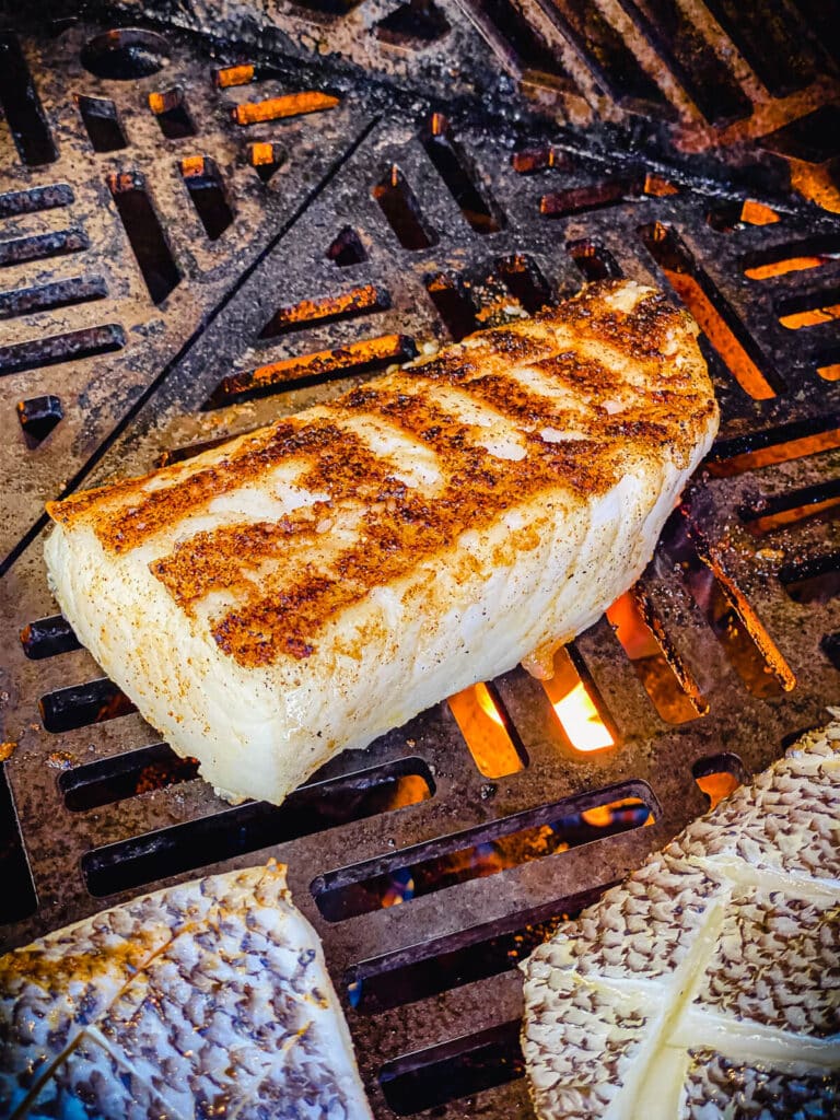 sea bass on the grill over flames