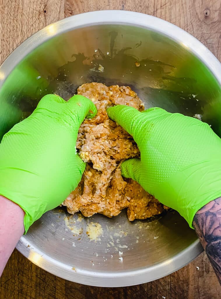 mixing ingredients for Nashville hot chicken burgers in a mixing bowl