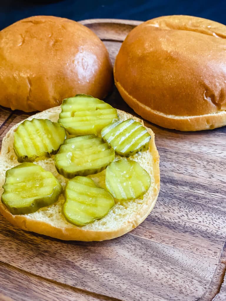 pickles on a bottom burger bun