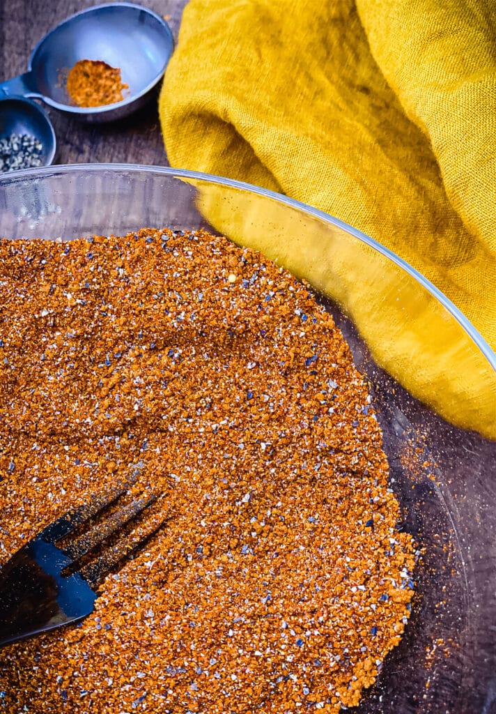 a fork in a bowl of Nashville hot seasoning