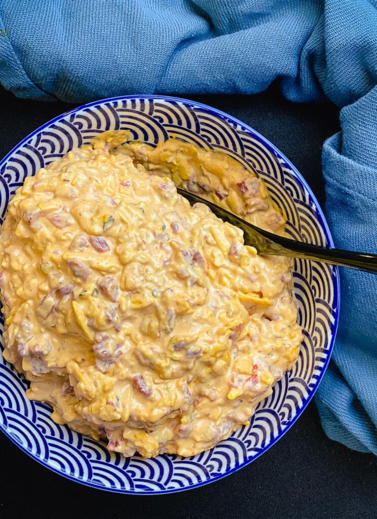 pimento cheese spread in a bowl with a spoon