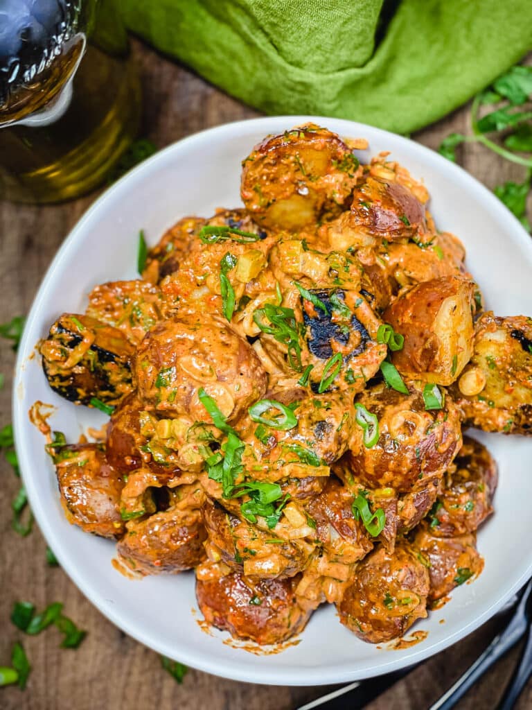 white bowl filled with grilled potato salad