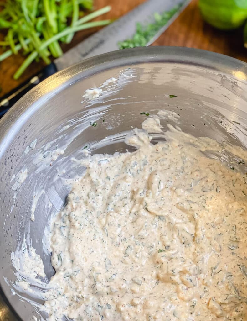 dressing for Mexican street corn salad in a bowl