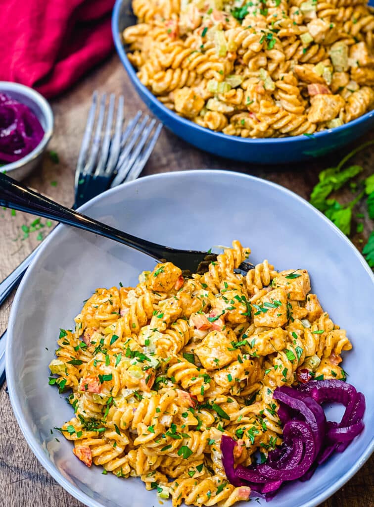 bowl of chicken pasta salad on a table