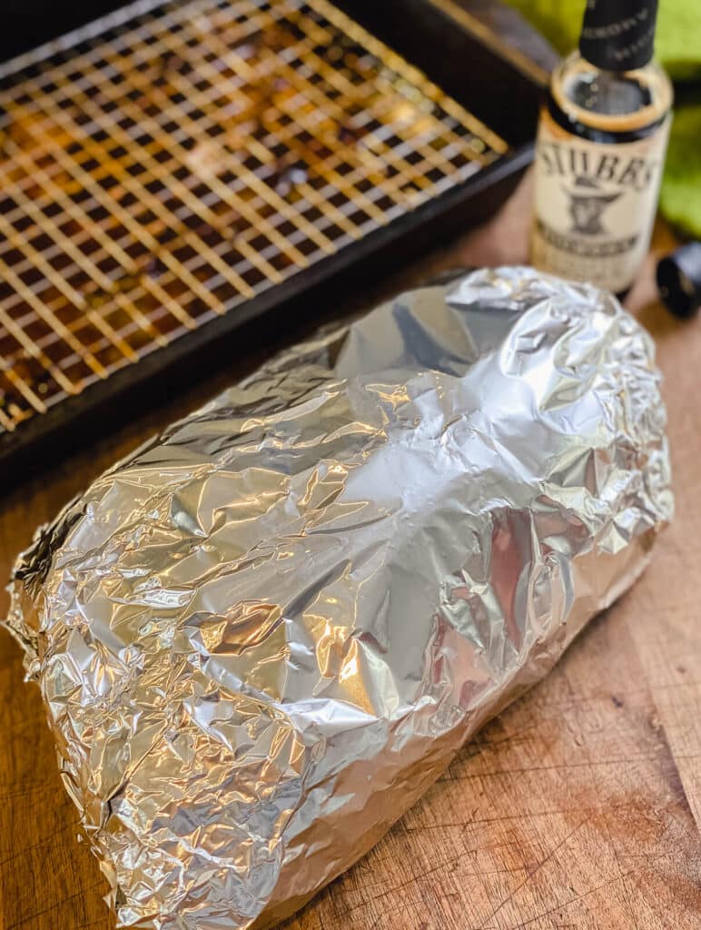pork butt wrapped tightly in aluminum foil