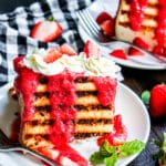 grilled angel food cake with strawberry puree on a table with mint