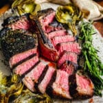 tuscan style porterhouse steak sliced on a platter