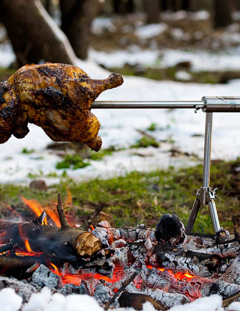 LB spinner being used over an open fire outdoors