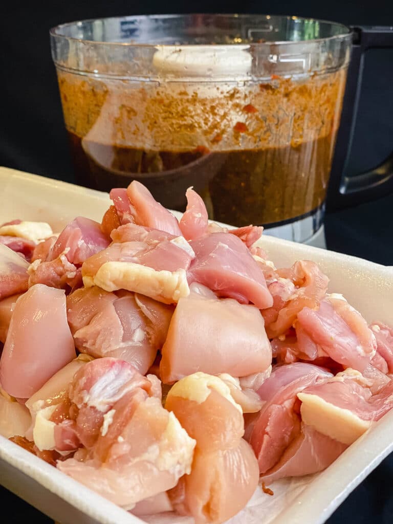 chicken cut into cubes for a jerk chicken recipe