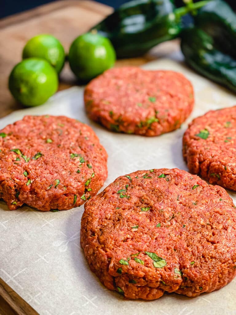 Mexican burger patties formed on parchment paper