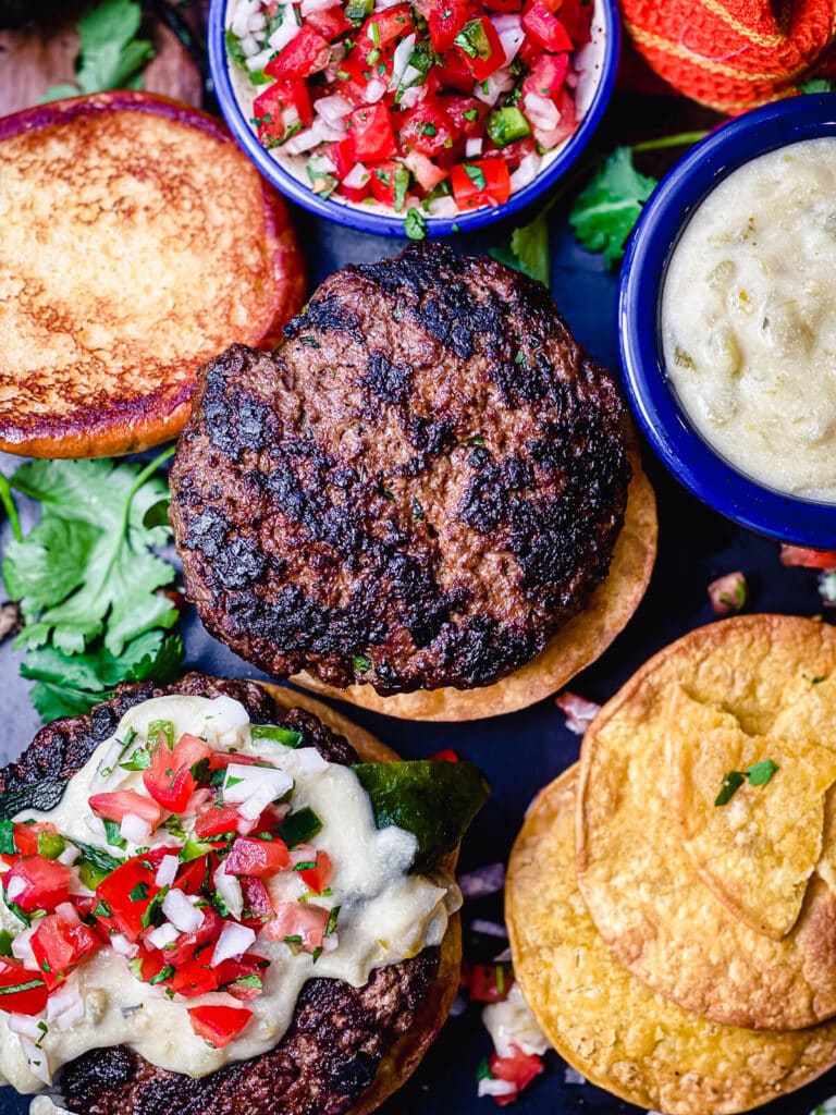 Mexican burgers being assembled with tortillas