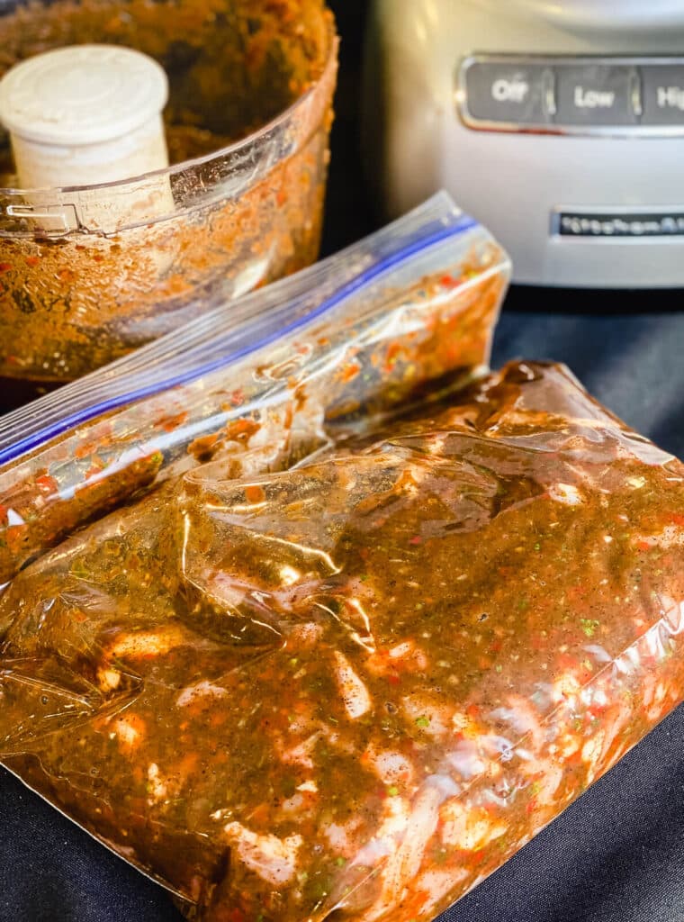 bag of chicken marinating in jerk marinade