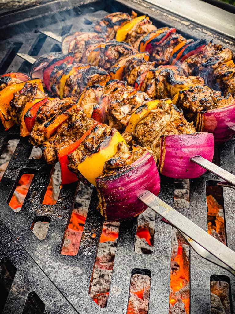 charred chicken kabobs on the grill