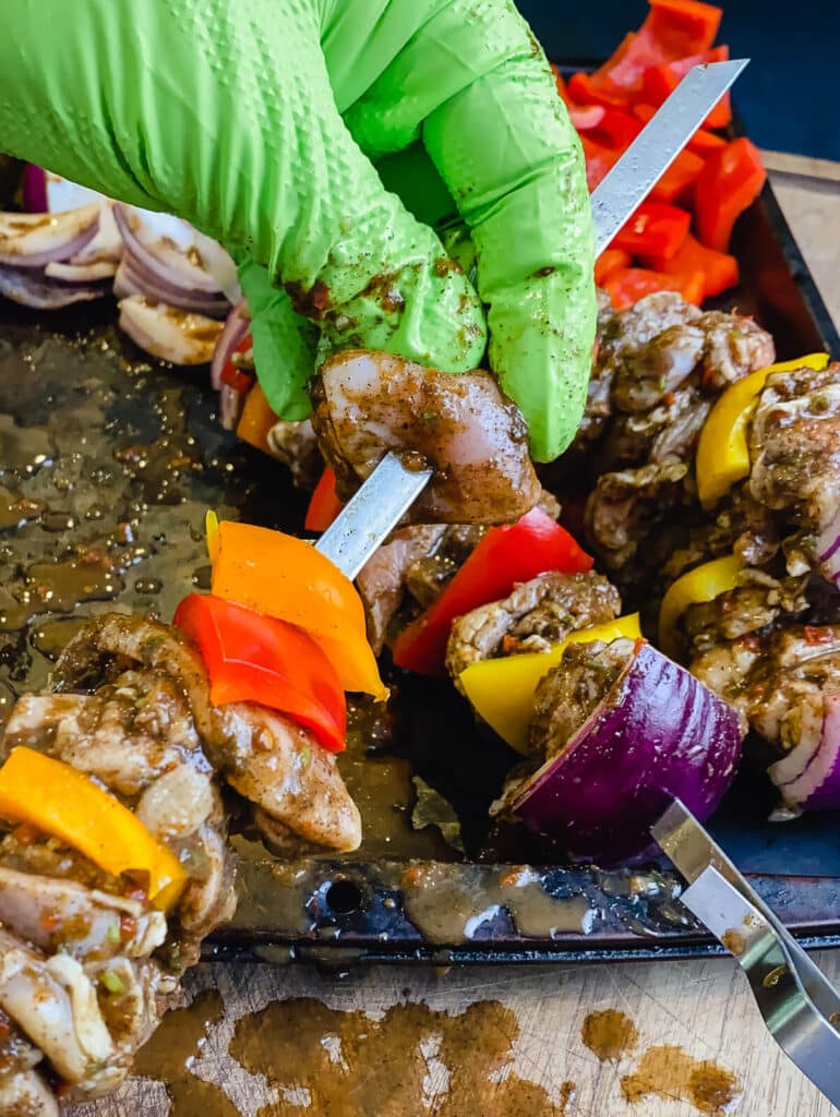 Jamaican jerk chicken skewers being assembled