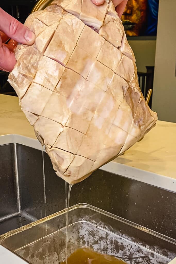 pork shoulder coming out of an apple juice brine