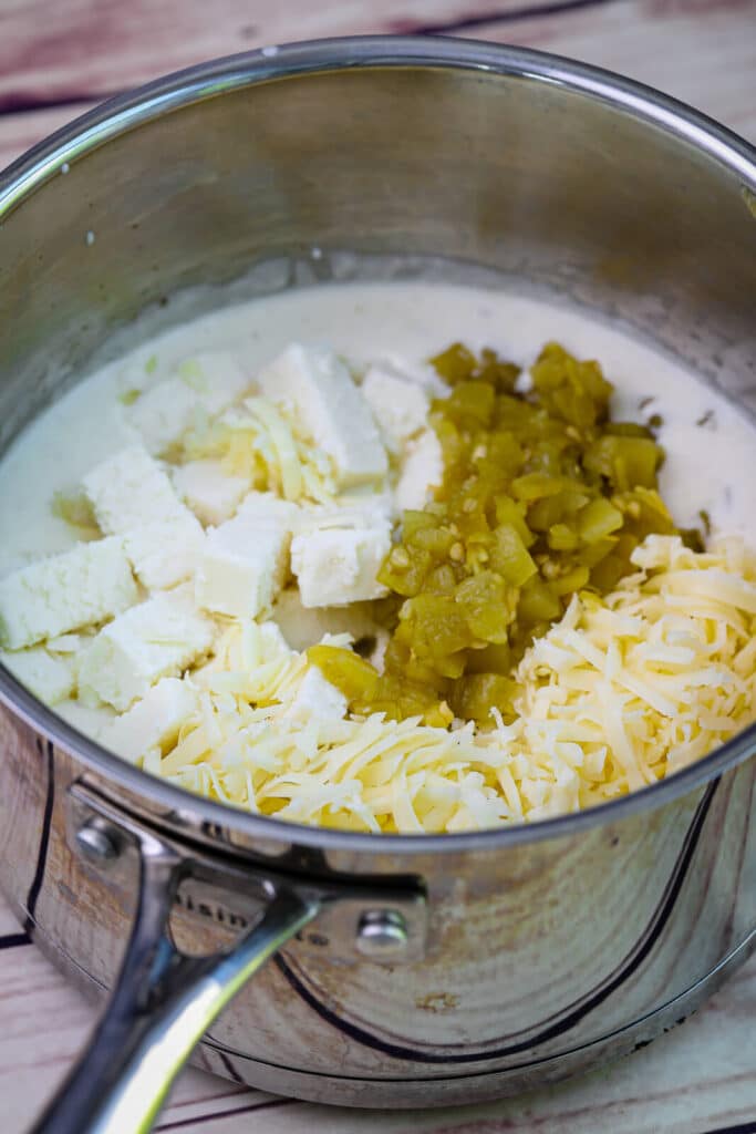 ingredients for queso fresco in a saucepan