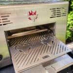 Schwank grills outside on a table