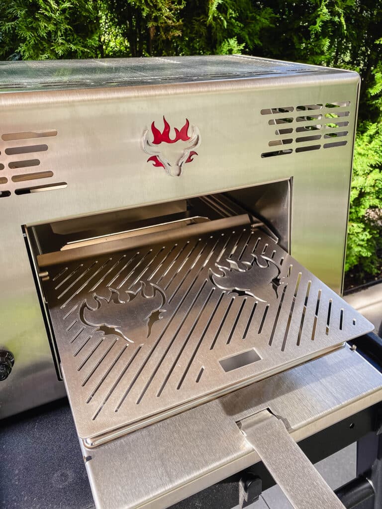 Schwank grills outside on a table