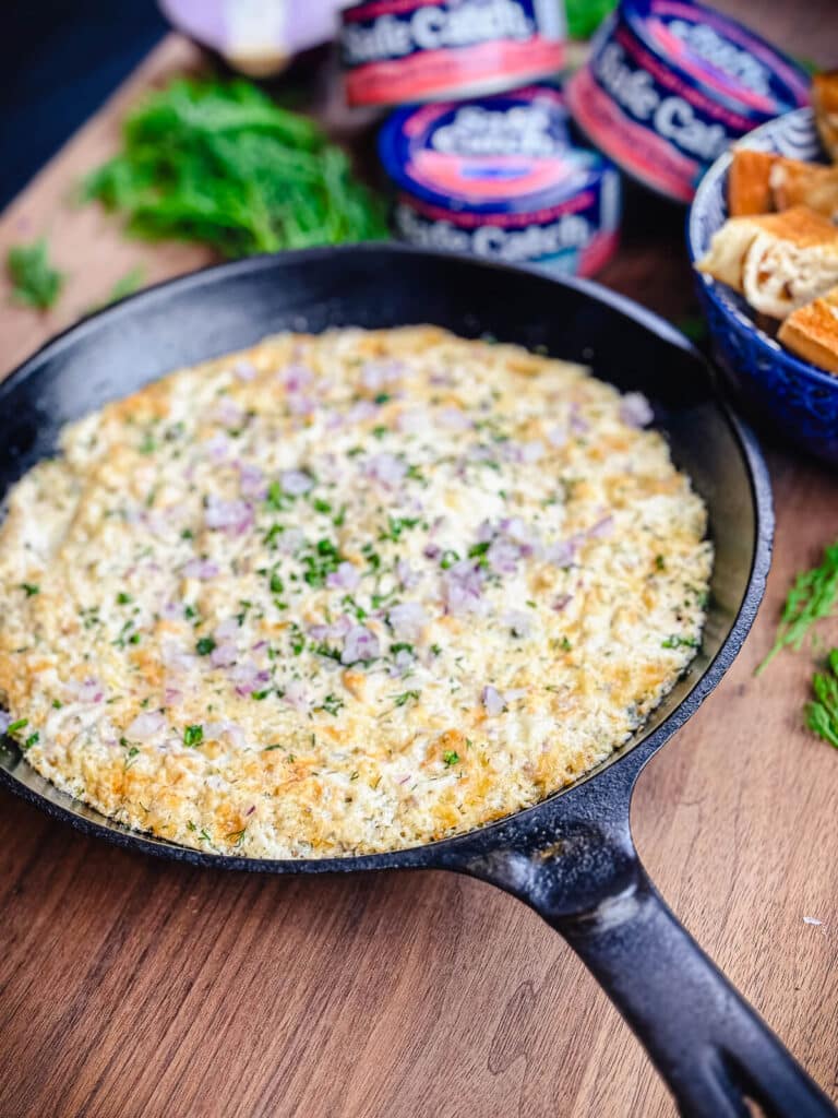 hot smoked salmon dip in a cast iron skillet