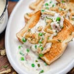 creamed tuna on toast with fried onions and peas