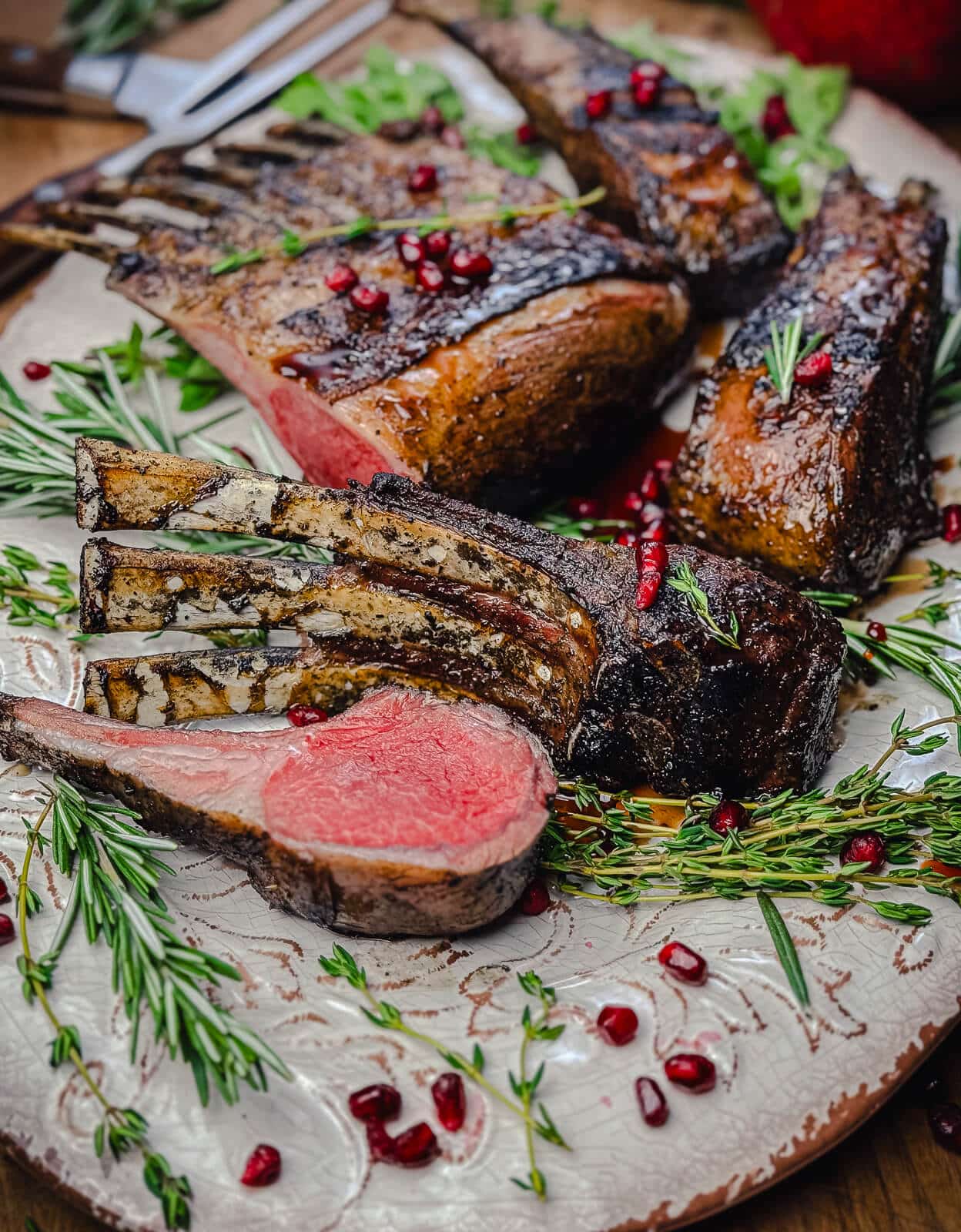 platter with grilled lamb chops and pomegranate seeds