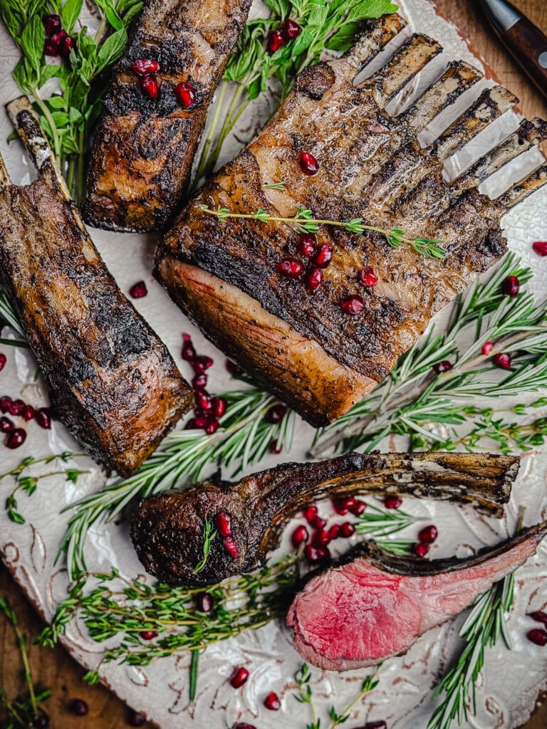 platter of grilled lamb chops with herbs looking overhead